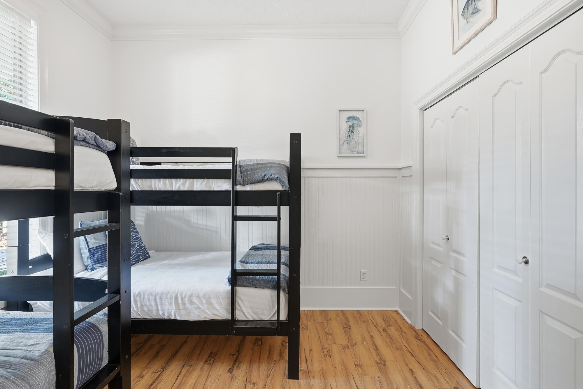 128 Seabreeze Boulevard Inlet Beach, FL 32461 - Photo 30 of 54 a bedroom with a bed and a wooden floor