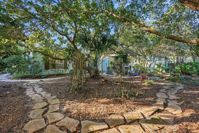 a view of a chairs and table in the patio
