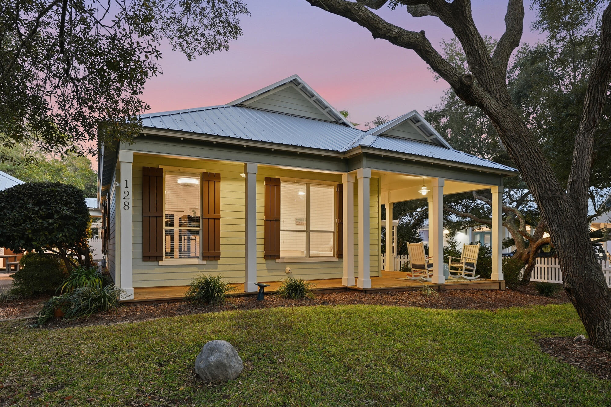 128 Seabreeze Boulevard Inlet Beach, FL 32461 - Photo 4 of 54 a front view of a house with garden