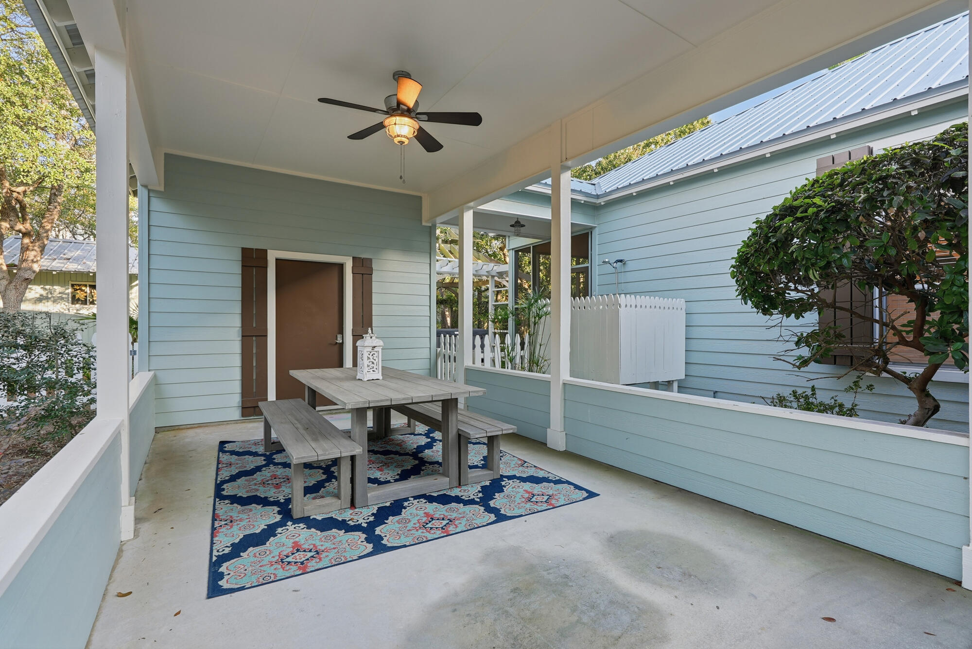 128 Seabreeze Boulevard Inlet Beach, FL 32461 - Photo 42 of 54 a view of a dinning table and chairs in patio of the house