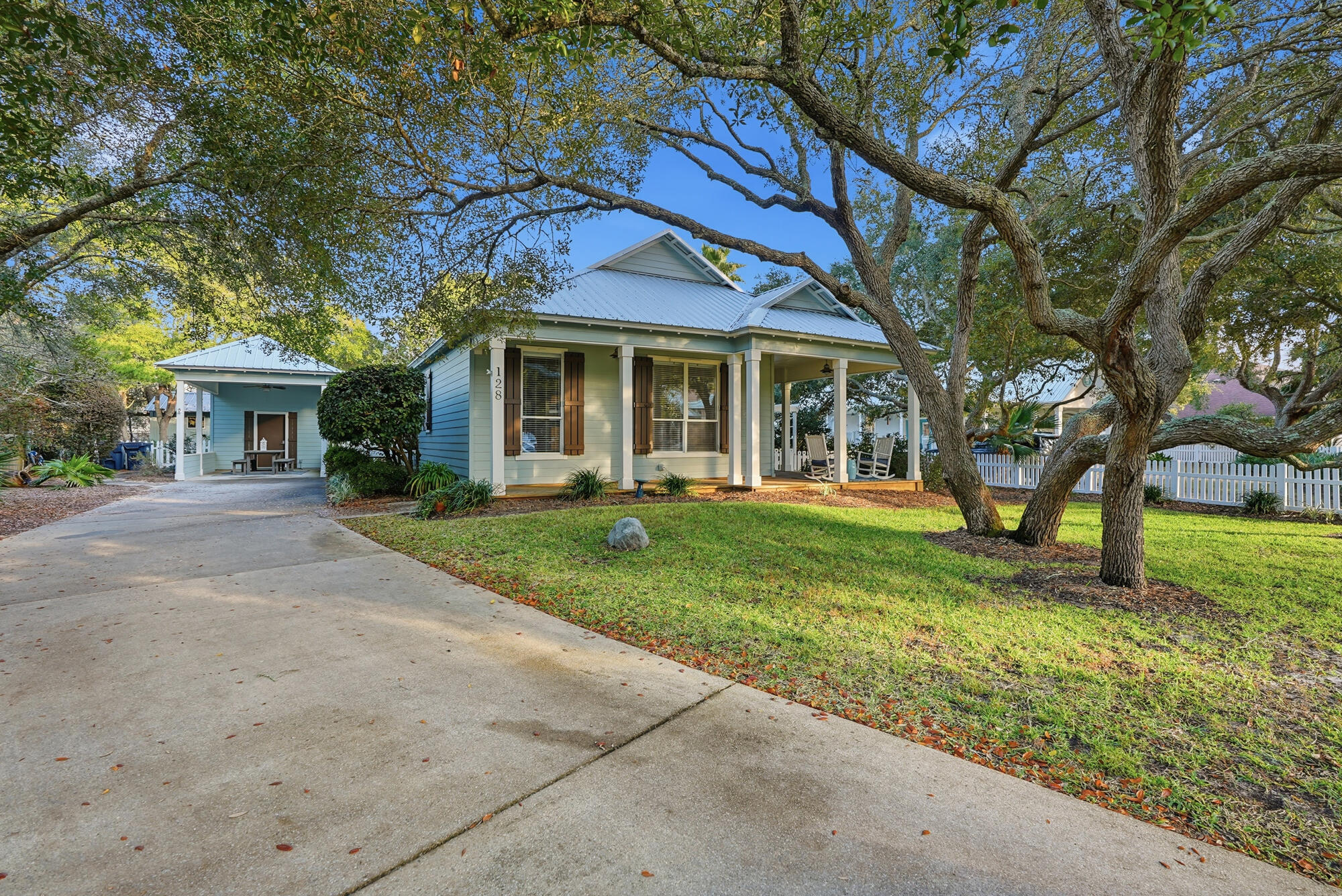 128 Seabreeze Boulevard Inlet Beach, FL 32461 - Photo 45 of 54 front view of a house with a yard