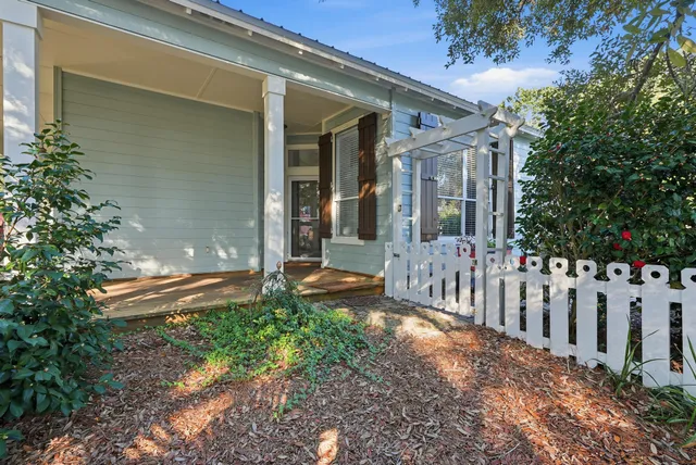 a living room with fireplace furniture and a large window