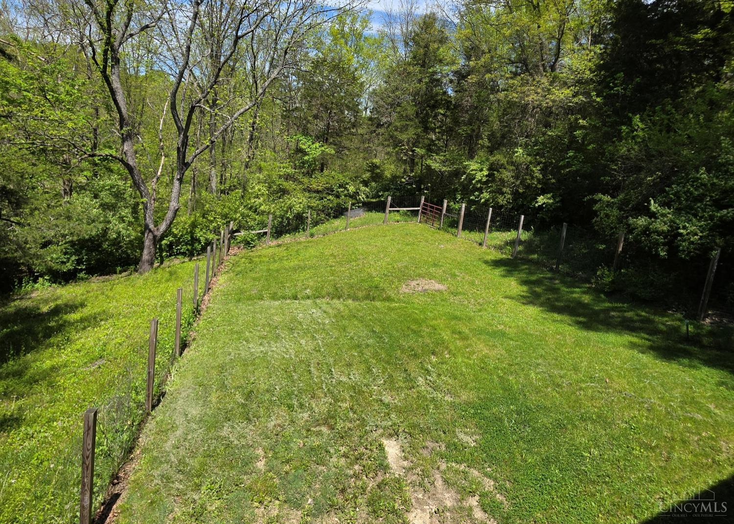 9045 Big Cedar Road Brookville, IN 47012 - Photo 25 of 52 Perfect for Pets - A fenced-in area ensures that your four-legged companions can roam and play freely and safely, making this property as welcoming for pets as it is for people.