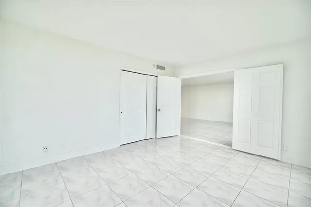 a view of an empty room and window