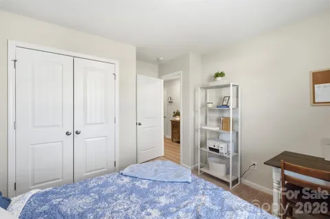 a bedroom with a bed and a cabinets