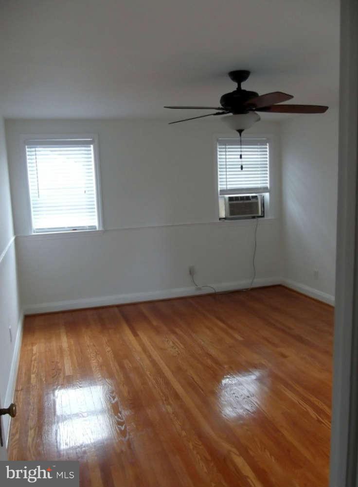 8412 Old Harford Road Baltimore, MD 21234 - Photo 11 of 25 a view of a kitchen with wooden floor and kitchen space