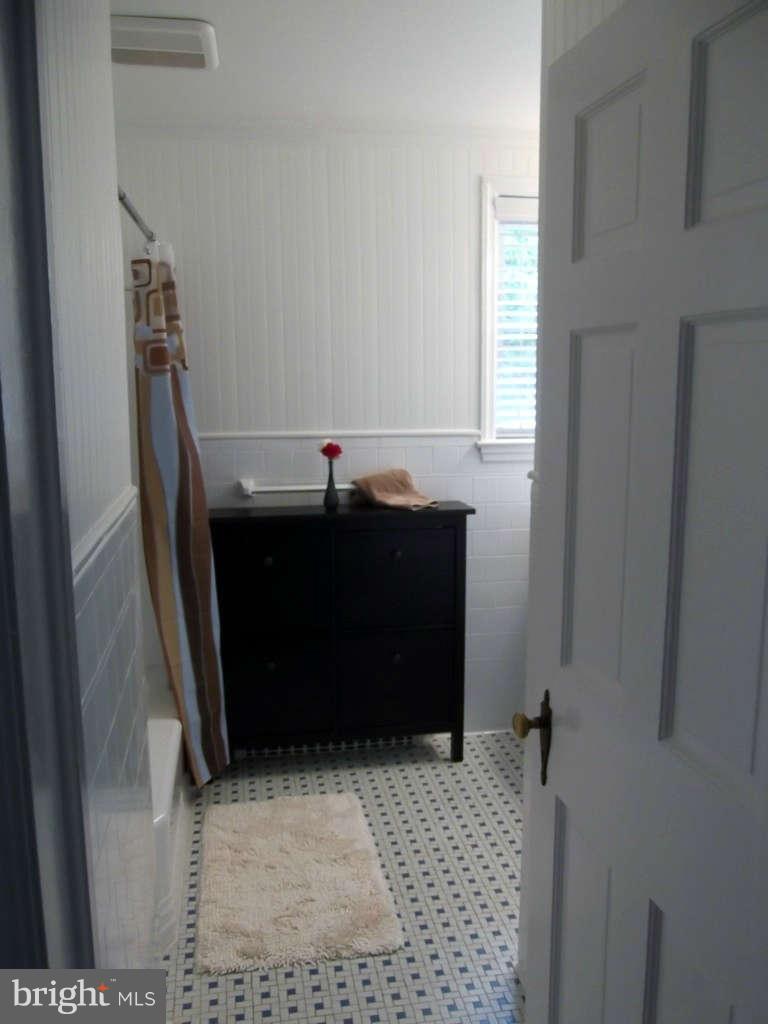 8412 Old Harford Road Baltimore, MD 21234 - Photo 15 of 25 a room with a cabinet and a window