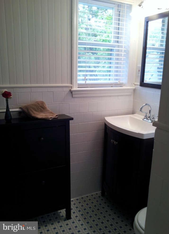 8412 Old Harford Road Baltimore, MD 21234 - Photo 16 of 25 a bathroom with a sink and a toilet