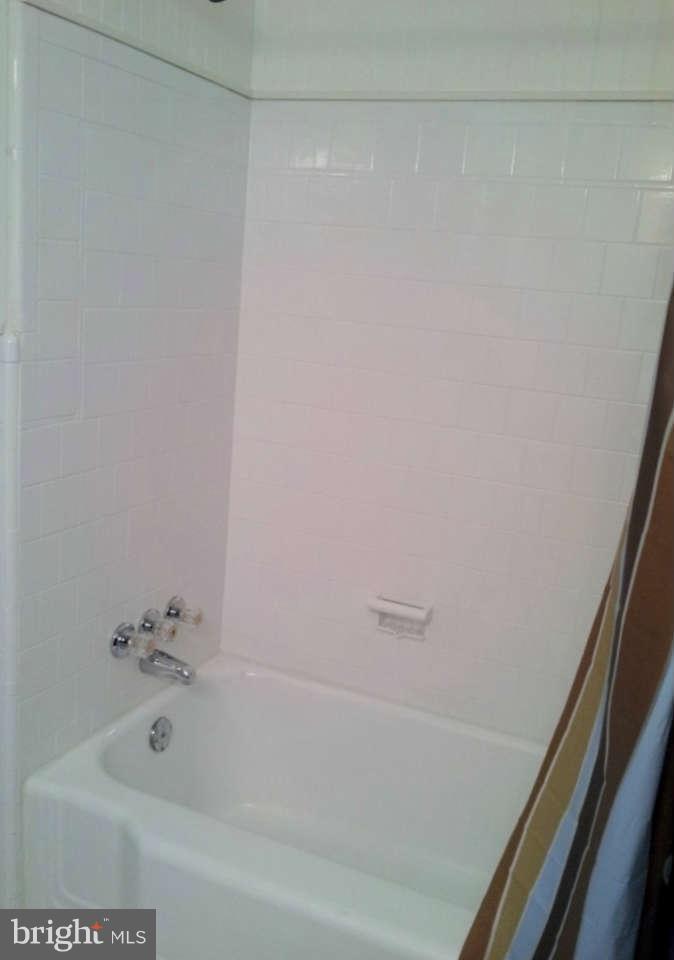 8412 Old Harford Road Baltimore, MD 21234 - Photo 18 of 25 a bathroom with a bathtub