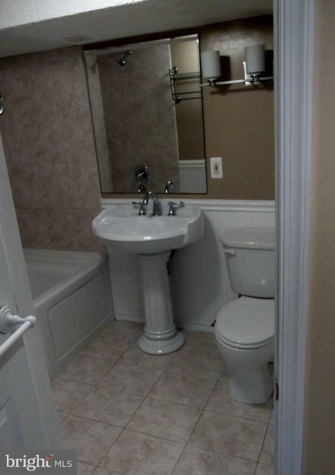 8412 Old Harford Road Baltimore, MD 21234 - Photo 25 of 25 a bathroom with a sink toilet and shower