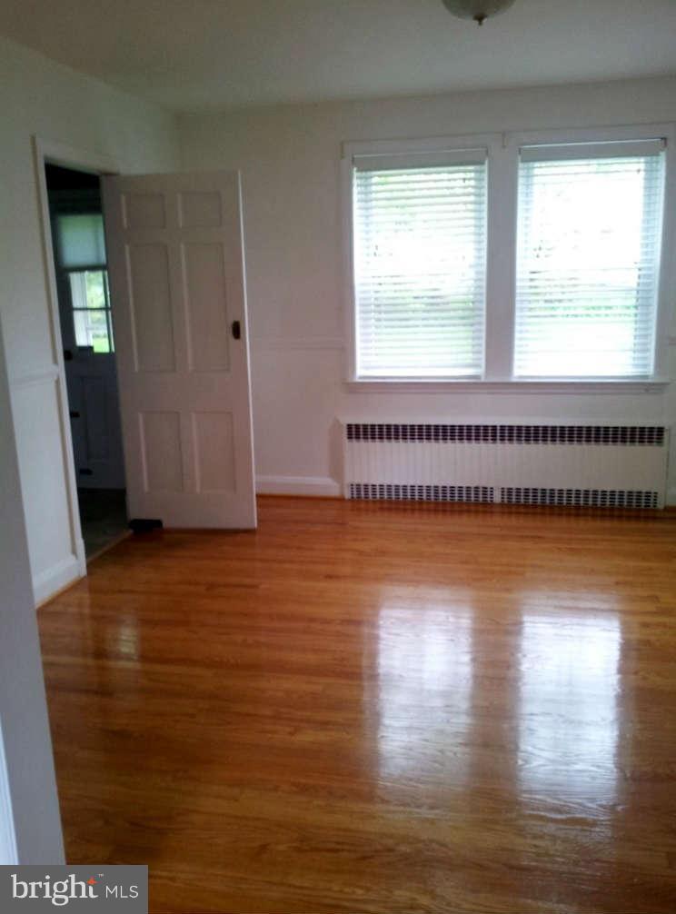 8412 Old Harford Road Baltimore, MD 21234 - Photo 6 of 25 a view of a room with wooden floor and window