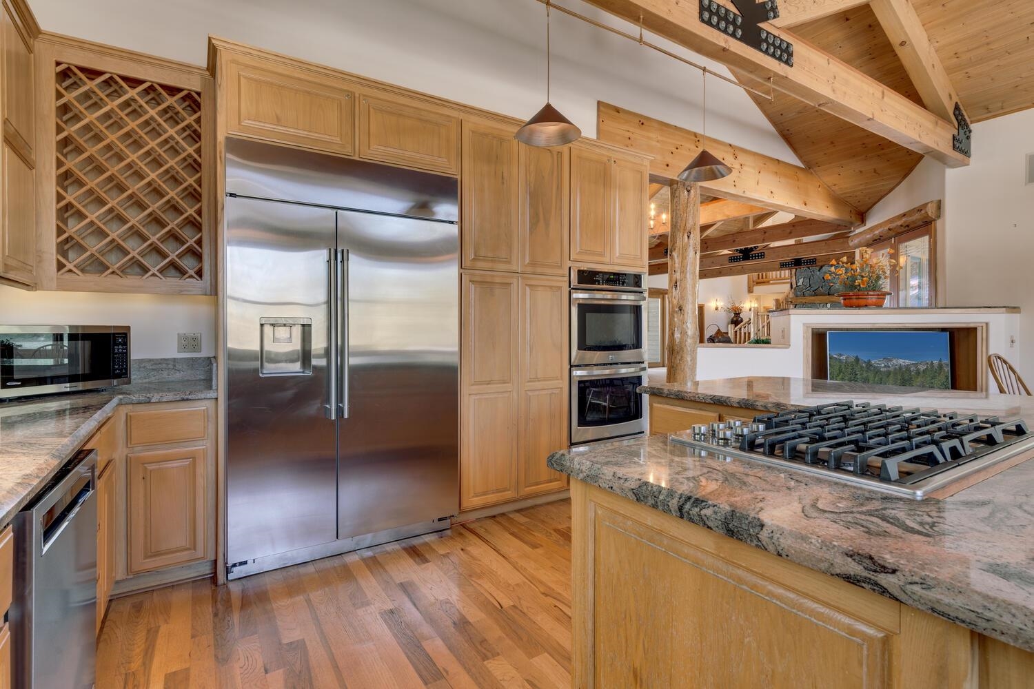 1809 Woods Point Way Northstar, CA 96161 - Photo 12 of 28 a kitchen with stainless steel appliances granite countertop a stove a sink and a refrigerator