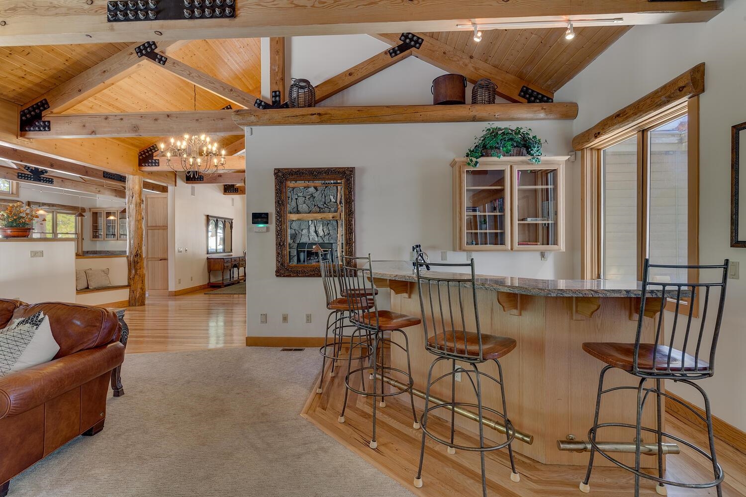 1809 Woods Point Way Northstar, CA 96161 - Photo 5 of 28 a living room with patio furniture and a chandelier