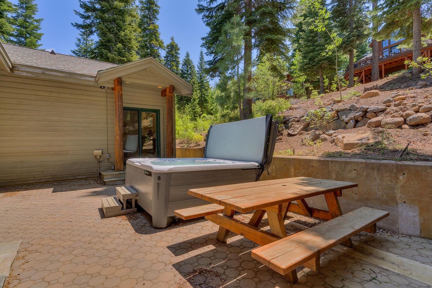 1809 Woods Point Way Northstar, CA 96161 - Photo 6 of 28 a view of a patio with table and chairs with wooden floor and fence