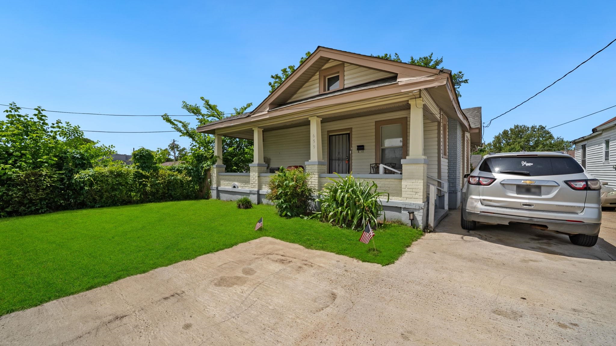 659 Decatur Street Memphis, TN 38107 - Photo 2 of 24 Charming single-story residence featuring a covered front porch, gabled roofline, and light-toned siding