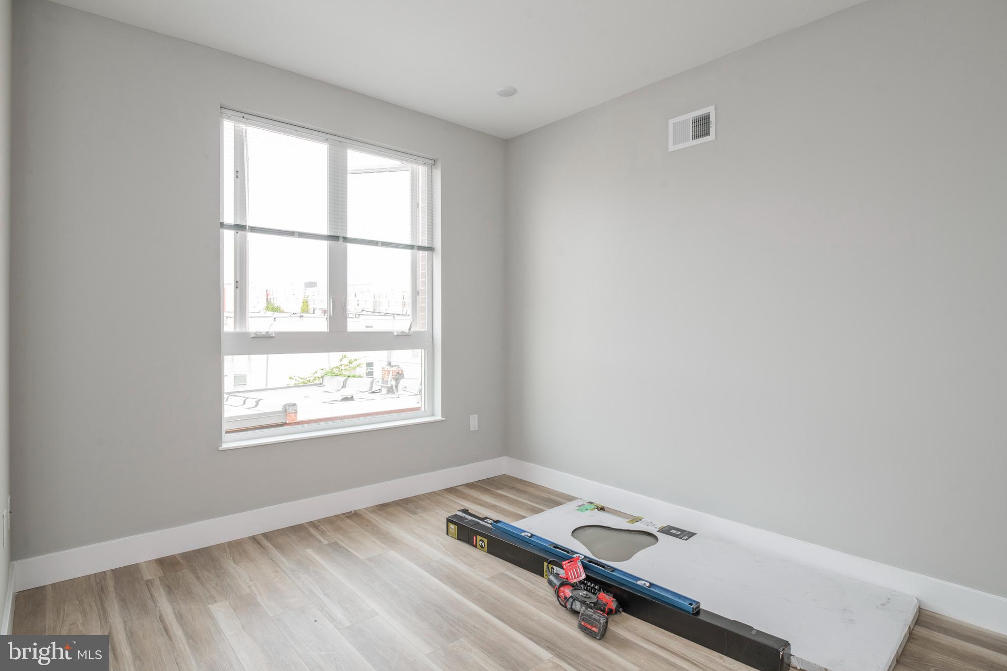 2009 North Darien Street, Unit 2 Philadelphia, PA 19122 - Photo 17 of 22 an empty room with a window
