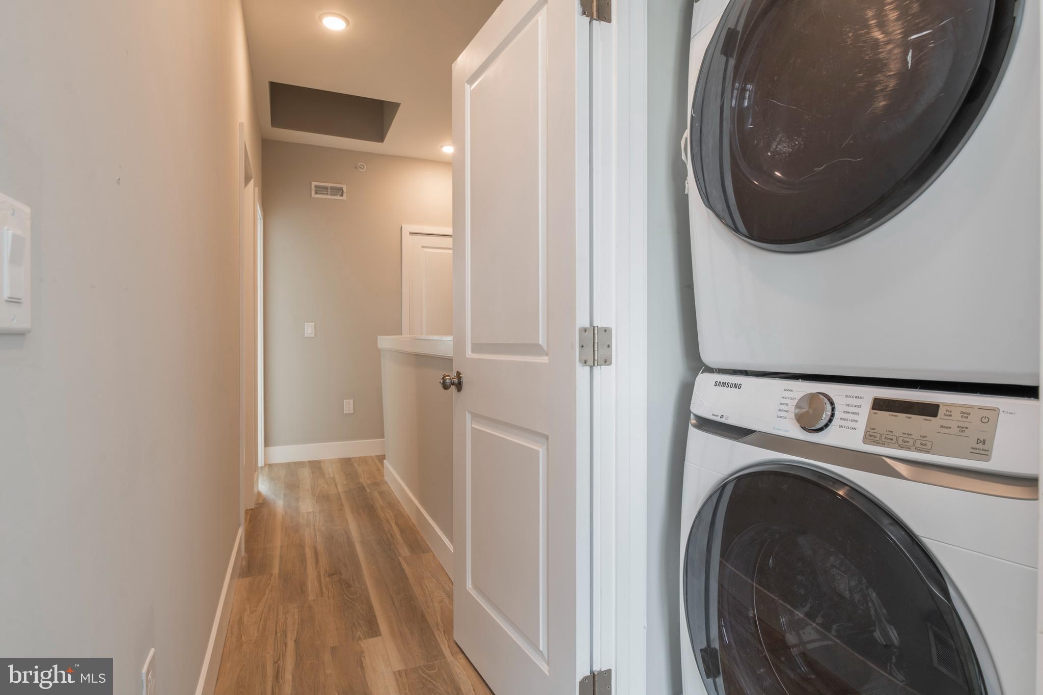 2009 North Darien Street, Unit 2 Philadelphia, PA 19122 - Photo 22 of 22 a view of a hallway with washer and dryer