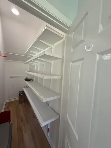 a view of a room with racks on the wall