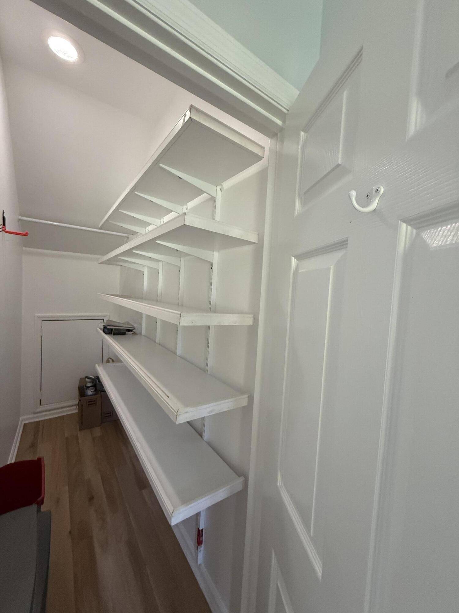 53 Spoonbill Way Key West, FL 33040 - Photo 12 of 32 a view of a room with racks on the wall