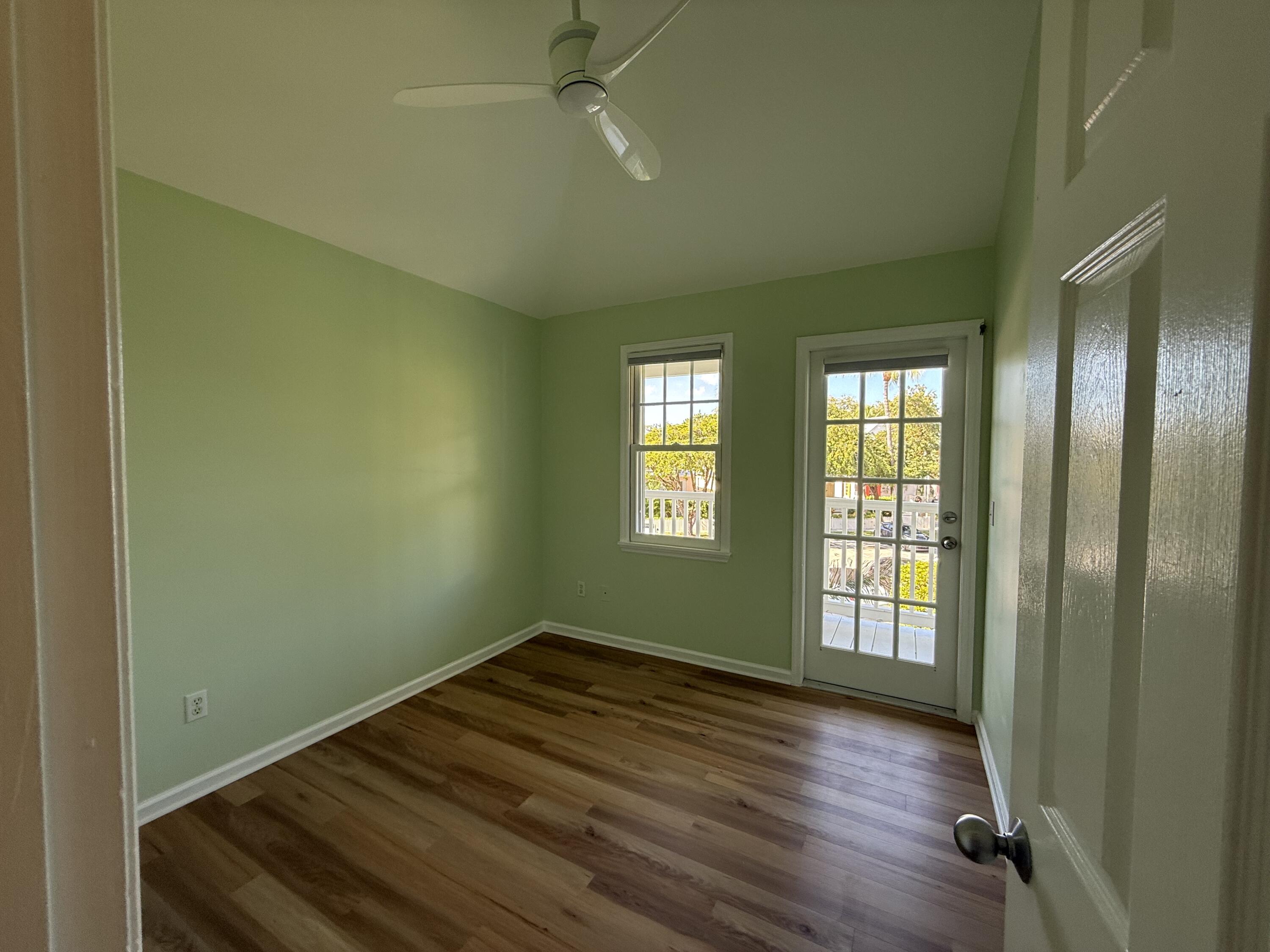 53 Spoonbill Way Key West, FL 33040 - Photo 16 of 32 an empty room with wooden floor and windows