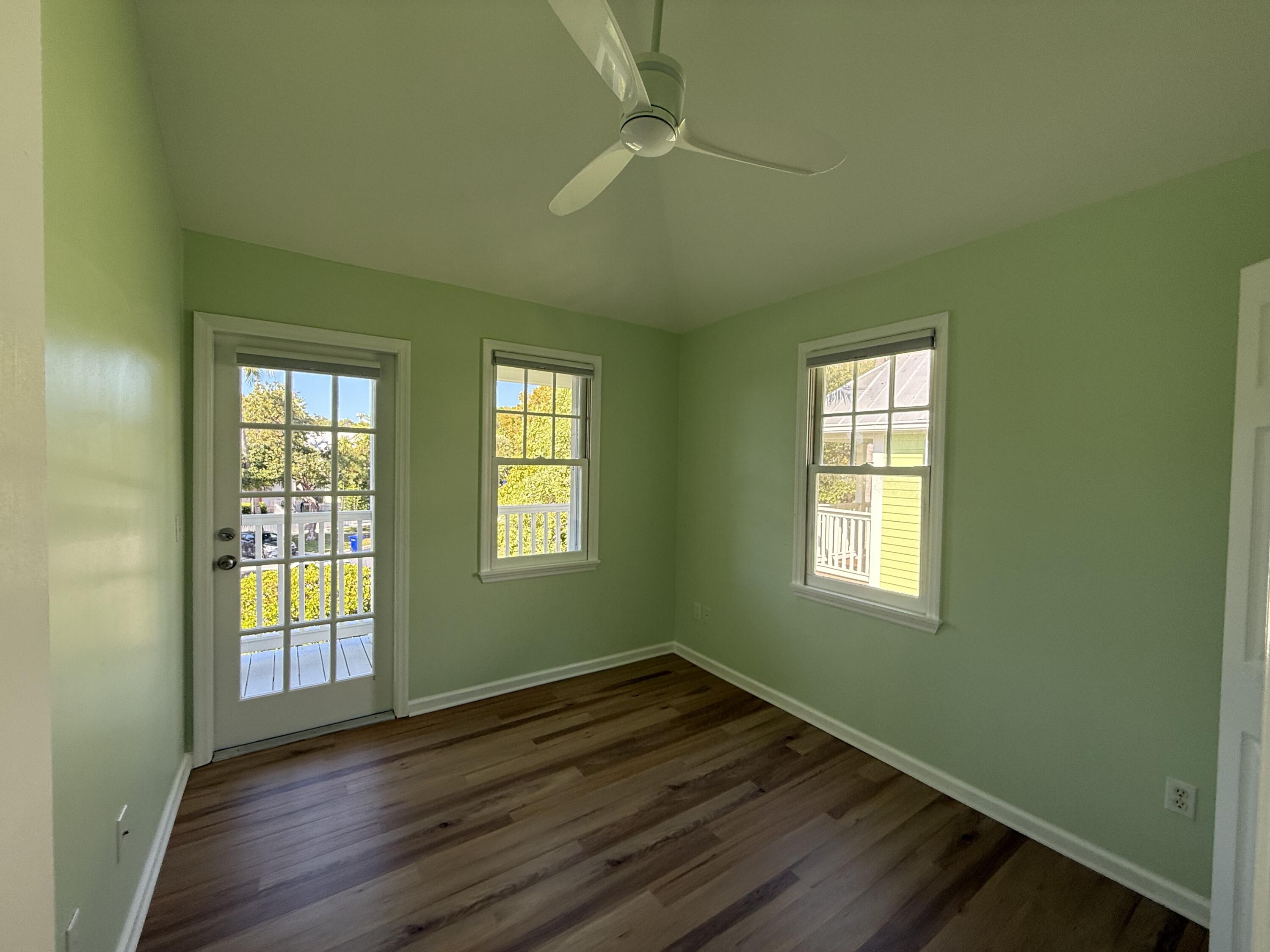 53 Spoonbill Way Key West, FL 33040 - Photo 19 of 32 a view of an empty room with wooden floor and a window