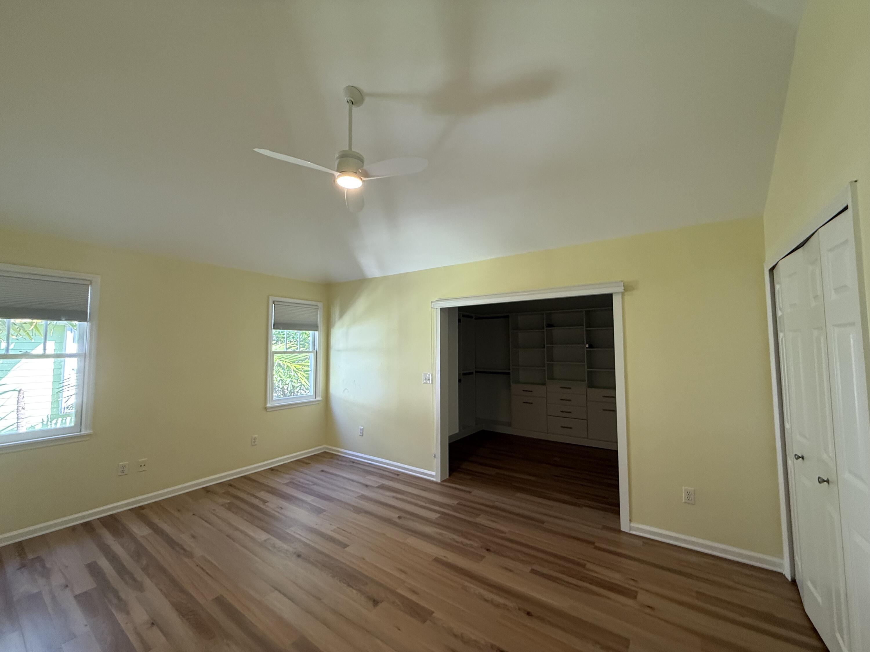 53 Spoonbill Way Key West, FL 33040 - Photo 20 of 32 an empty room with wooden floor and windows