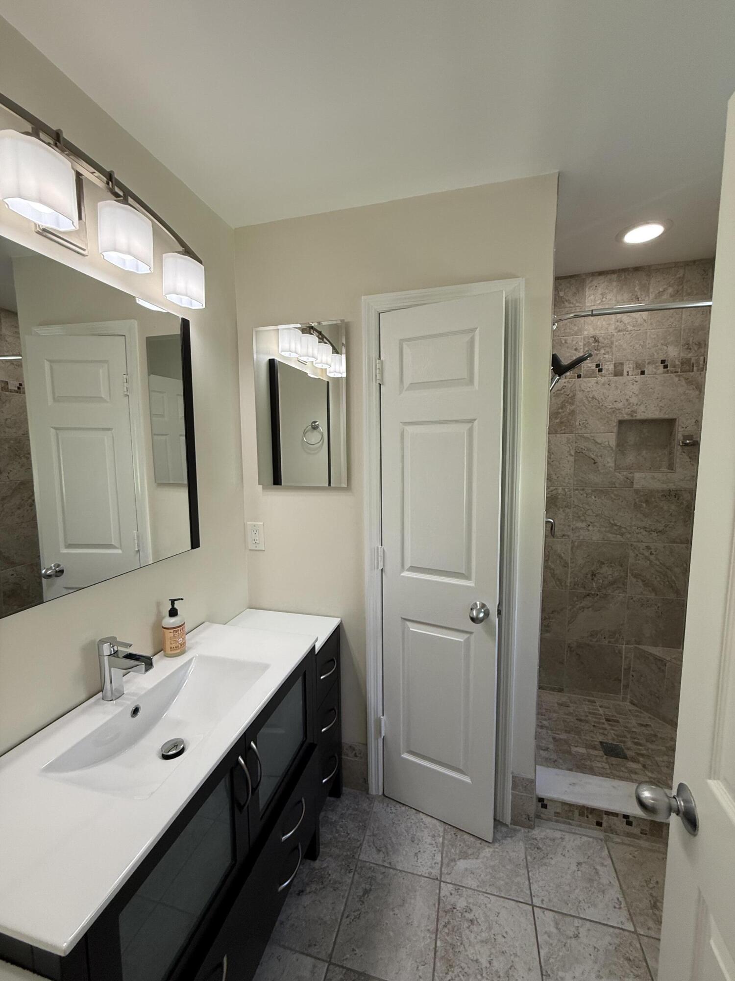 53 Spoonbill Way Key West, FL 33040 - Photo 21 of 32 a bathroom with a double vanity sink mirror and shower