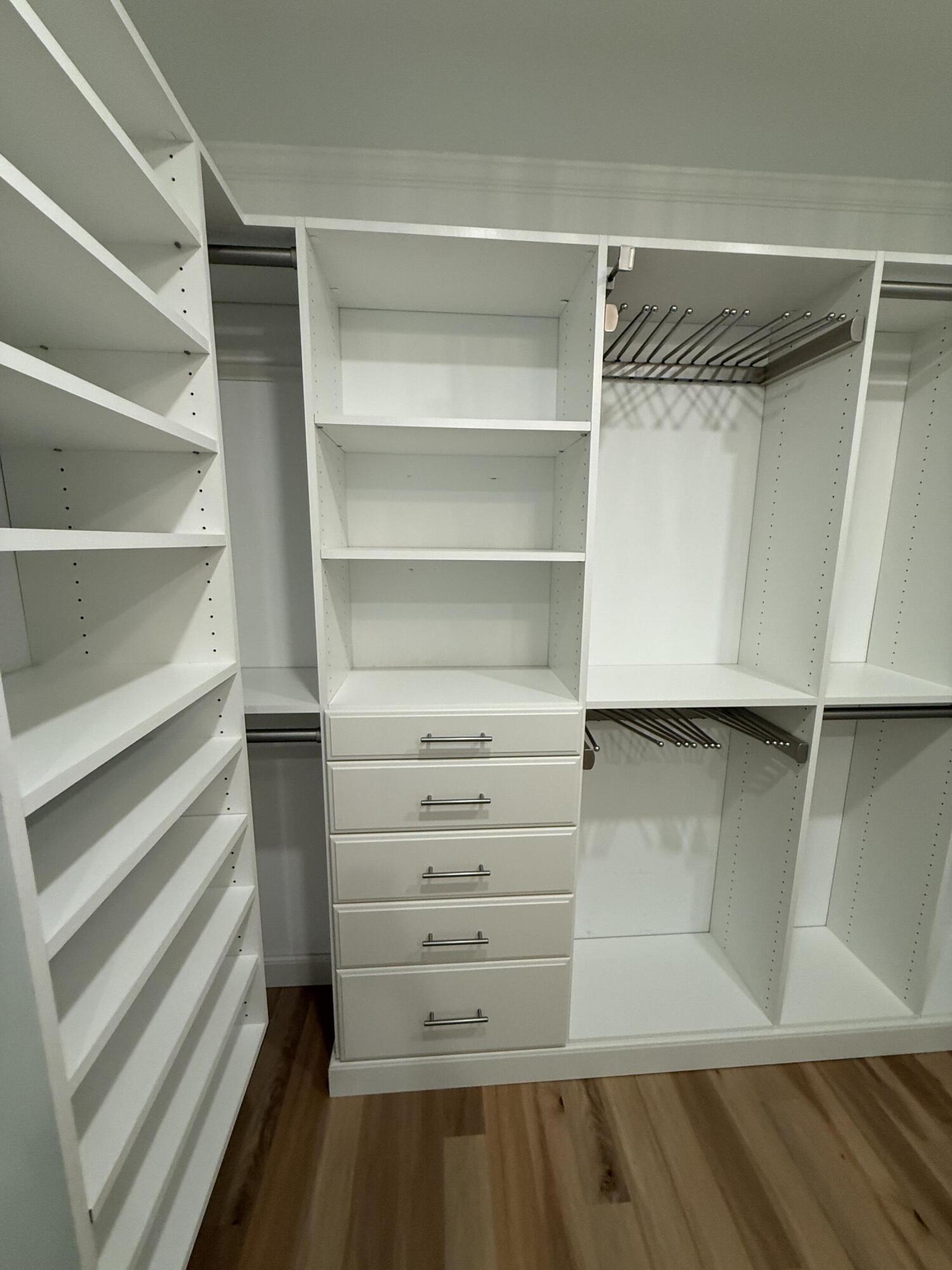 53 Spoonbill Way Key West, FL 33040 - Photo 25 of 32 a view of walk in closet with empty racks