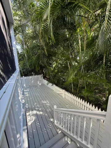 a view of balcony with wooden floor