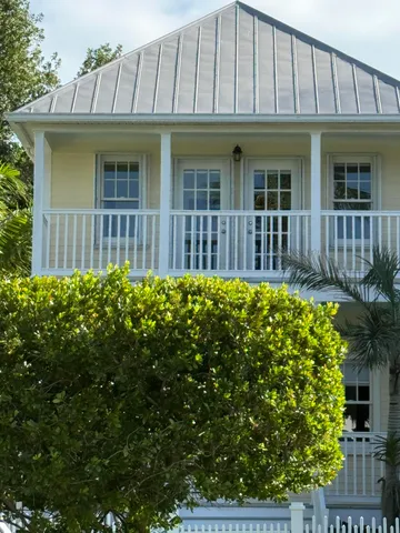 a view of a house with a flower garden