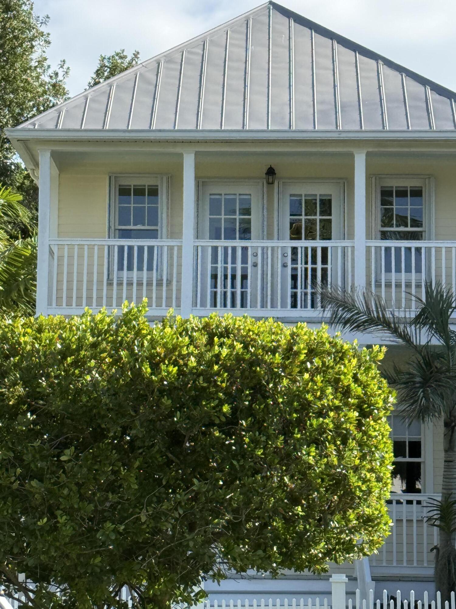 53 Spoonbill Way Key West, FL 33040 - Photo 3 of 32 a view of a house with a flower garden