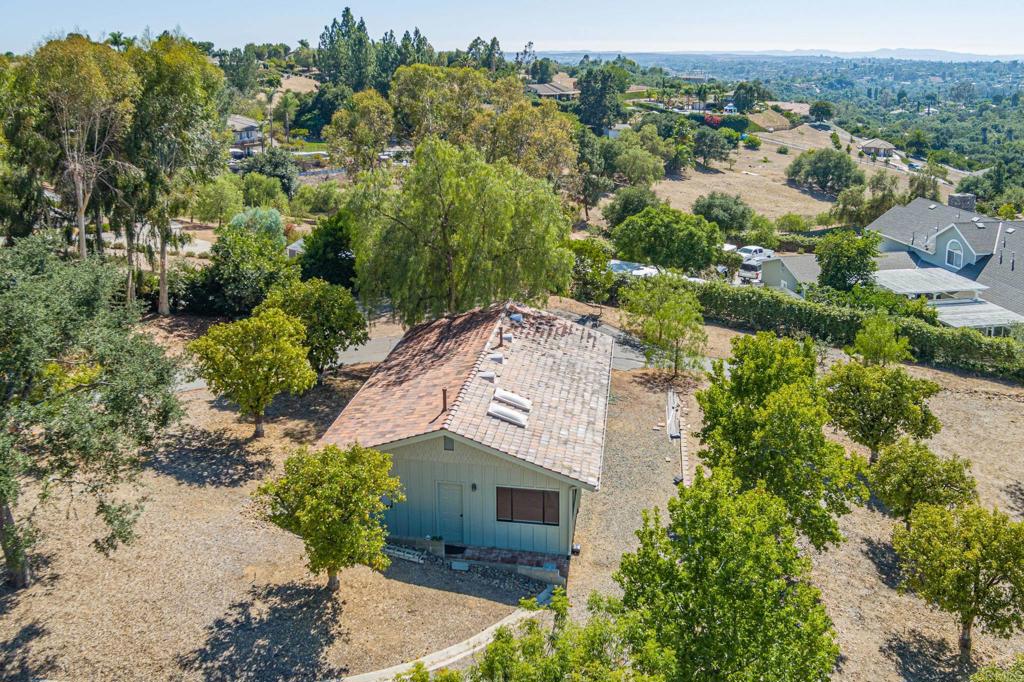 145 Yucca Road Fallbrook, CA 92028 - Photo 46 of 58 an aerial view of a house with a yard and mountain view in back