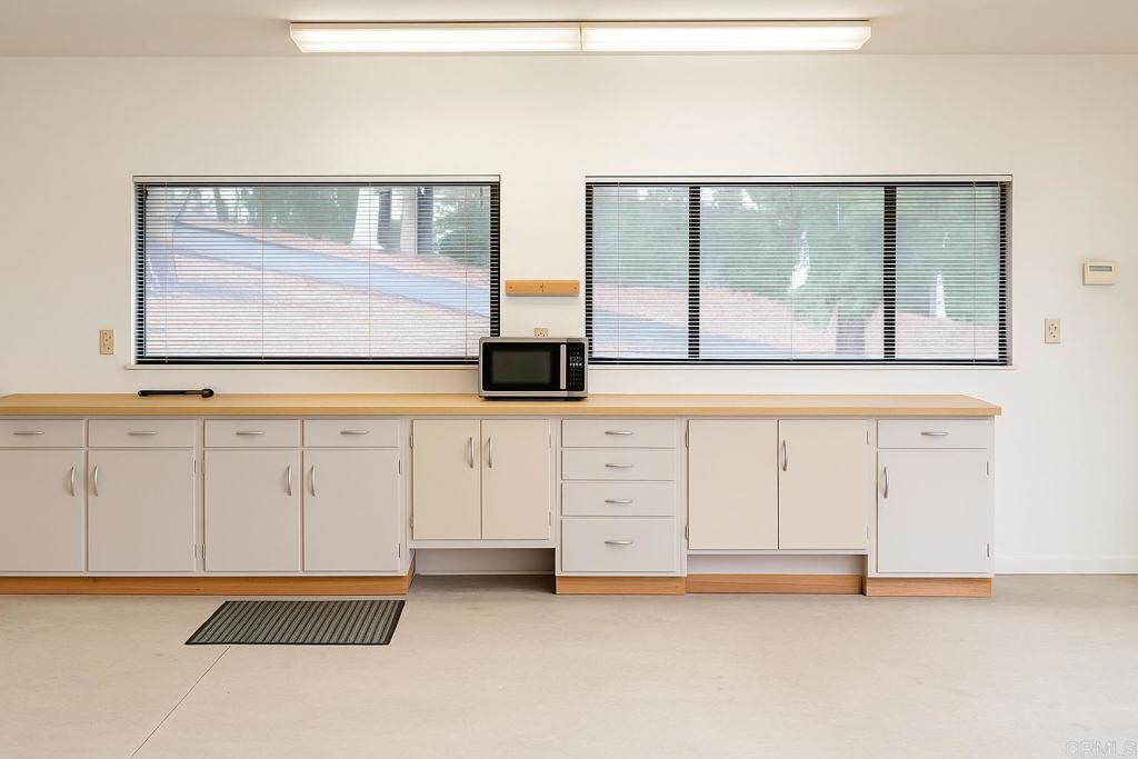 145 Yucca Road Fallbrook, CA 92028 - Photo 50 of 58 a view of a kitchen with white cabinets