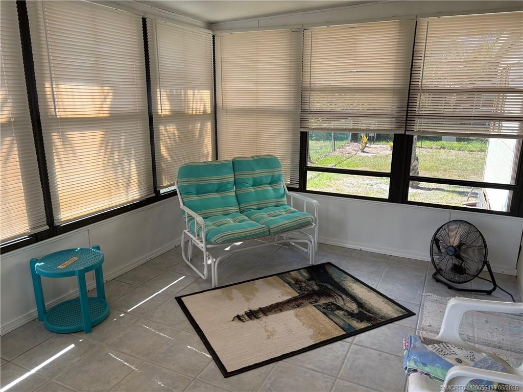 2856 Southwest Toronado Trail Stuart, FL 34997 - Photo 13 of 20 a living room with furniture and a window