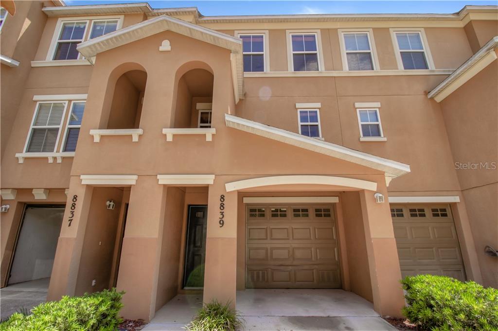 8839 White Sage Loop Lakewood Ranch, FL 34202 - Photo 1 of 1 a front view of a house with a yard