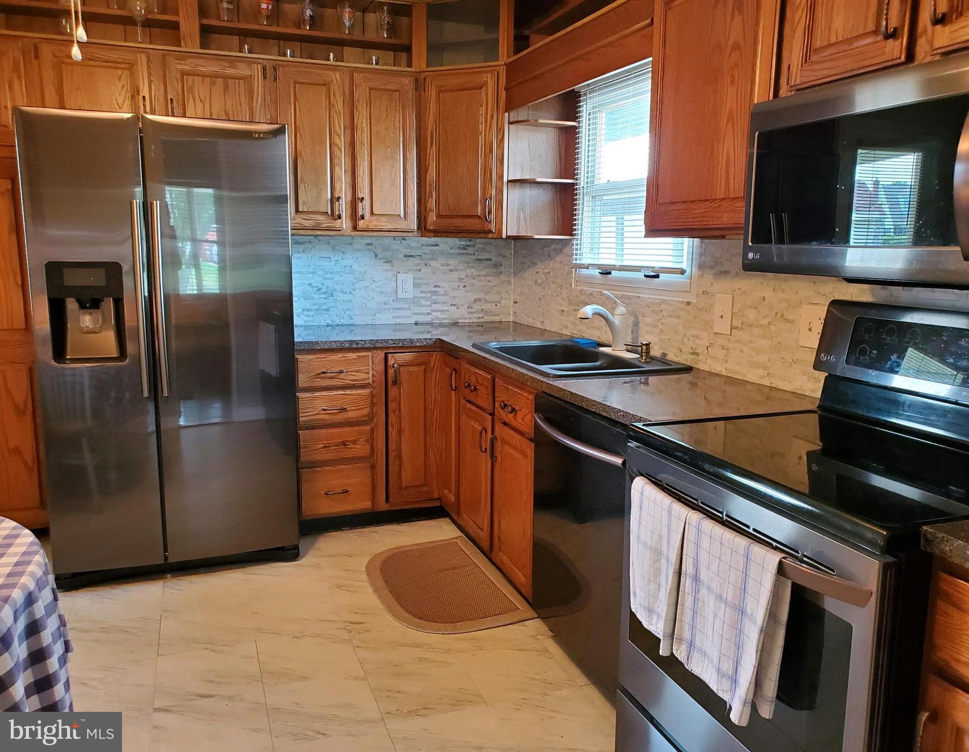 316 Queen Street Frederick, MD 21701 - Photo 9 of 28 Kitchen with black SS appliances