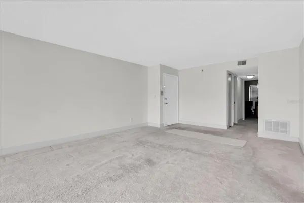 a view of an empty room and closet