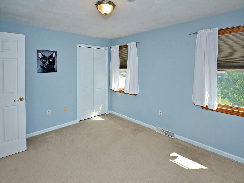 79 Rustic Ridge Drive Pittsburgh, PA 15239 - Photo 18 of 25 Bedroom #2 with neutral carpeting.