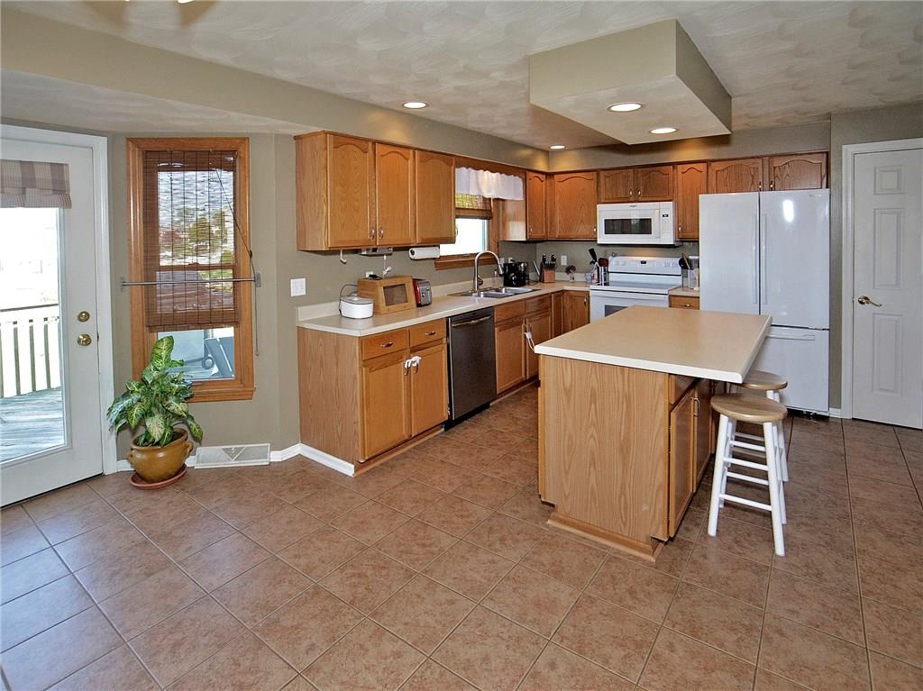 79 Rustic Ridge Drive Pittsburgh, PA 15239 - Photo 6 of 25 Kitchen is bright and spacious, with door that leads to back deck.