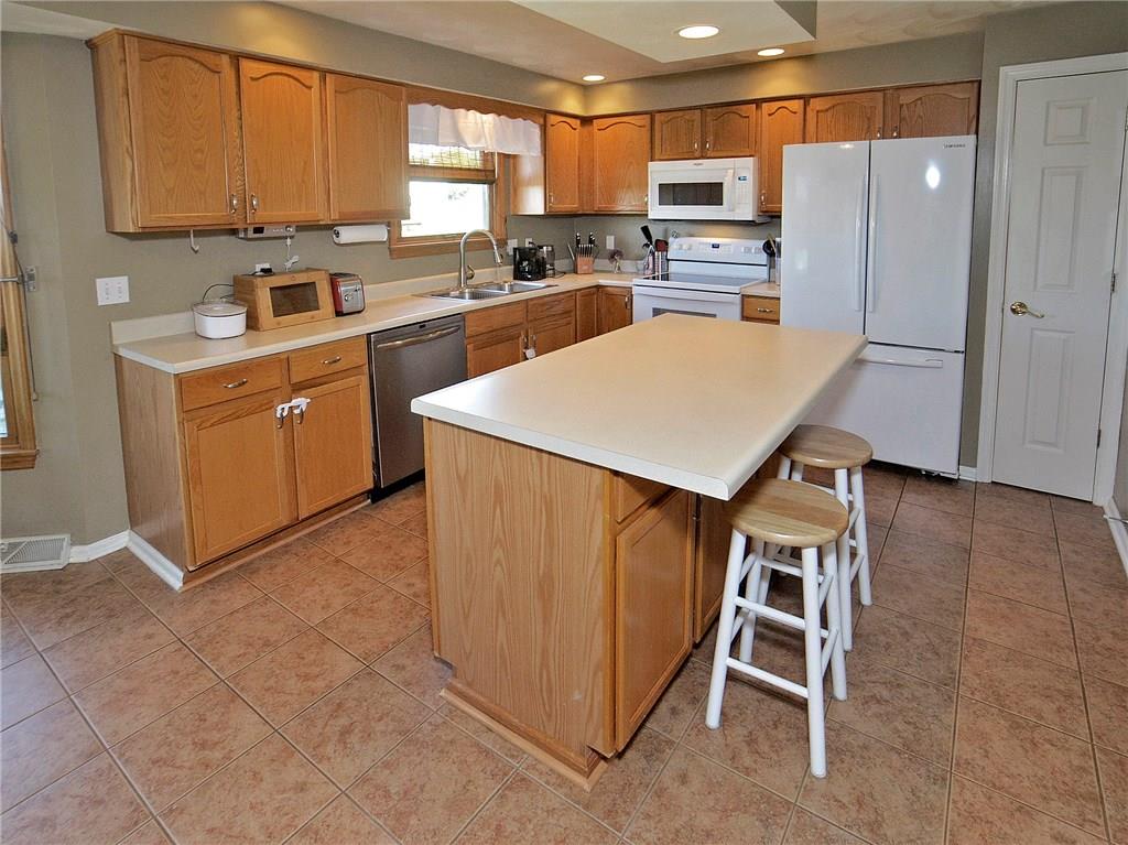 79 Rustic Ridge Drive Pittsburgh, PA 15239 - Photo 8 of 25 This kitchen has plenty of wood cabinetry, a pantry and recessed lighting.