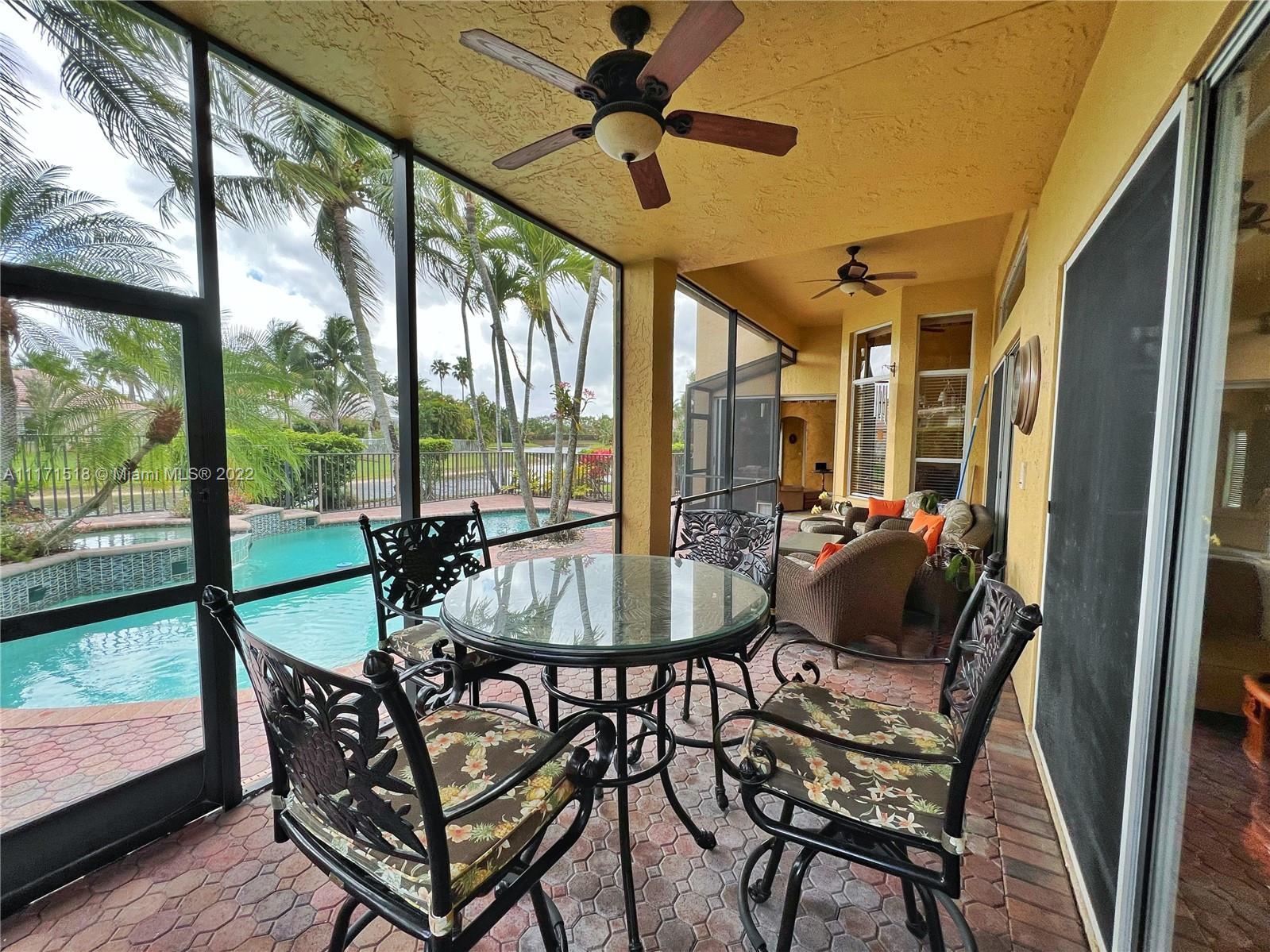 20022 Ocean Key Drive Boca Raton, FL 33498 - Photo 14 of 39 Patio - Screened sitting area with ceiling fans and lighting