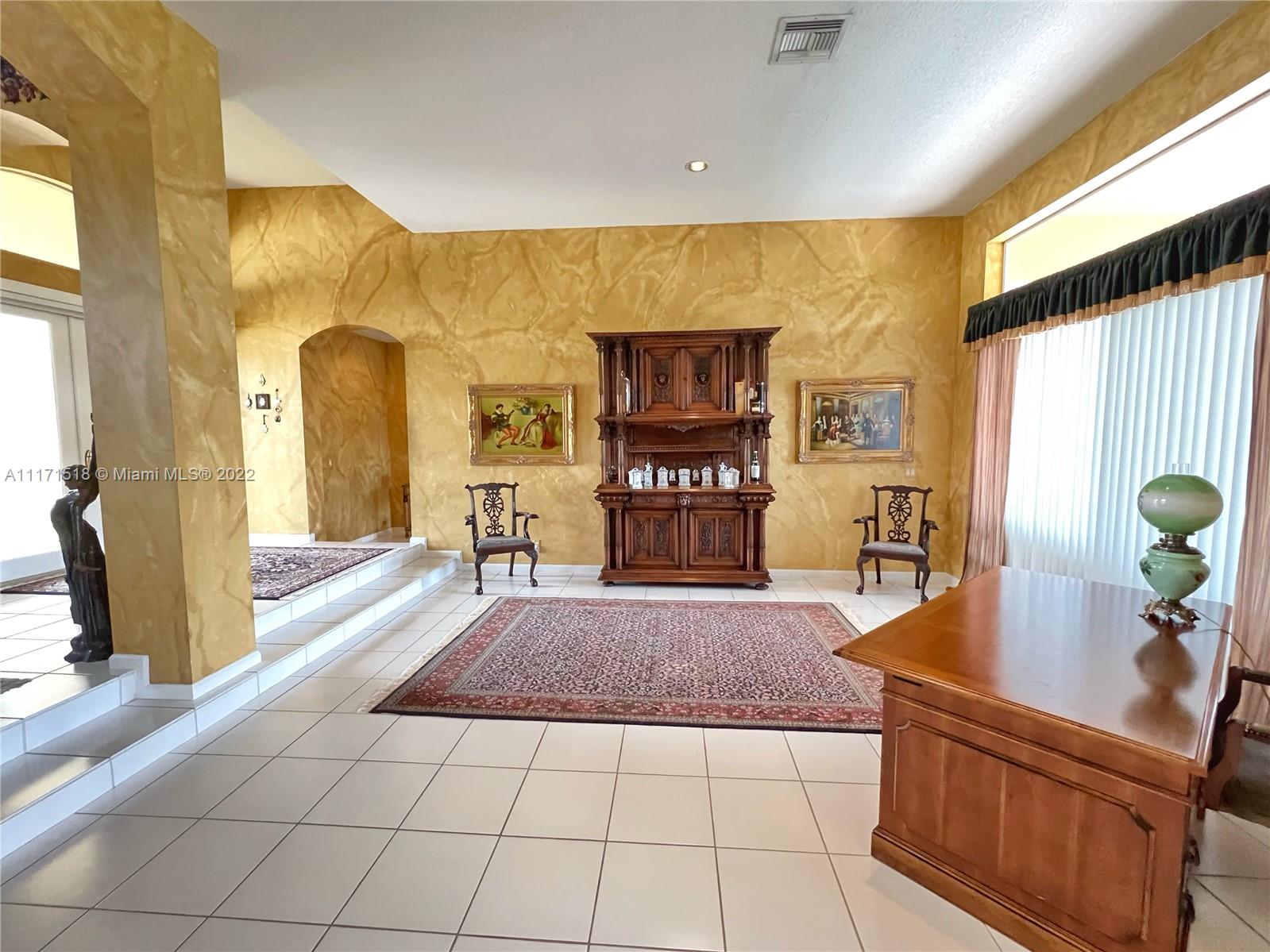 20022 Ocean Key Drive Boca Raton, FL 33498 - Photo 3 of 39 Living Room with Front Door and Patio access