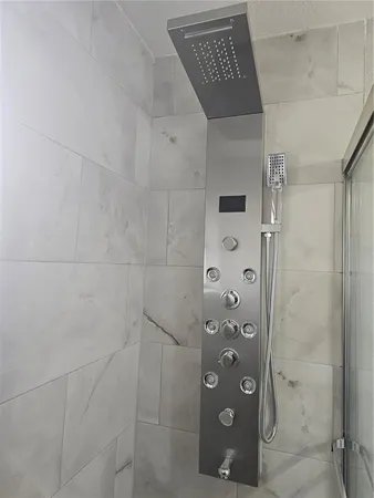 a bathroom with a sink mirror and toilet