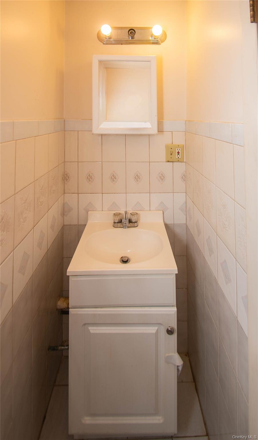 20 Valley Road Forestburgh, NY 12777 - Photo 20 of 38 Half bathroom featuring tile walls and vanity