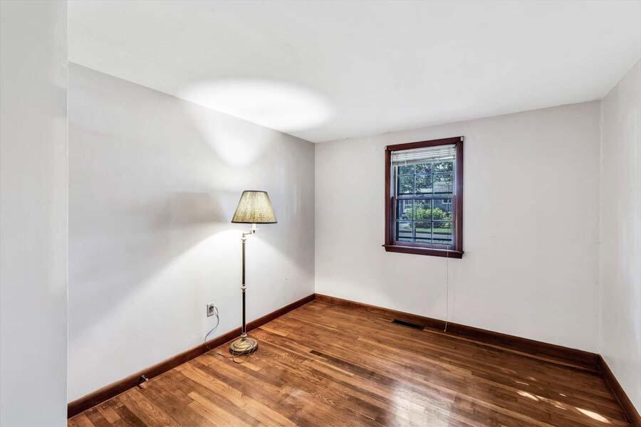 18 Pamet Road West Yarmouth, MA 02673 - Photo 13 of 23 a view of empty room with wooden floor