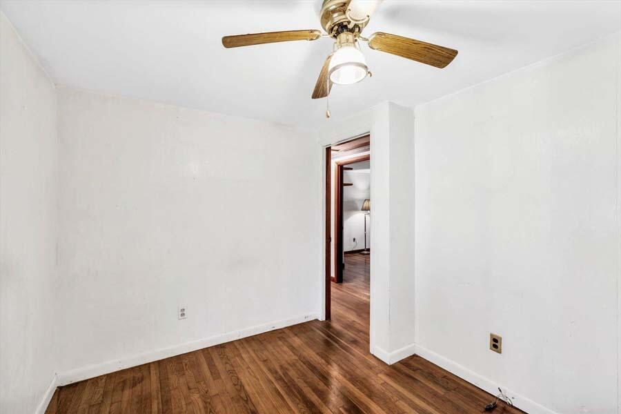 18 Pamet Road West Yarmouth, MA 02673 - Photo 16 of 23 an empty room with wooden floor and fan