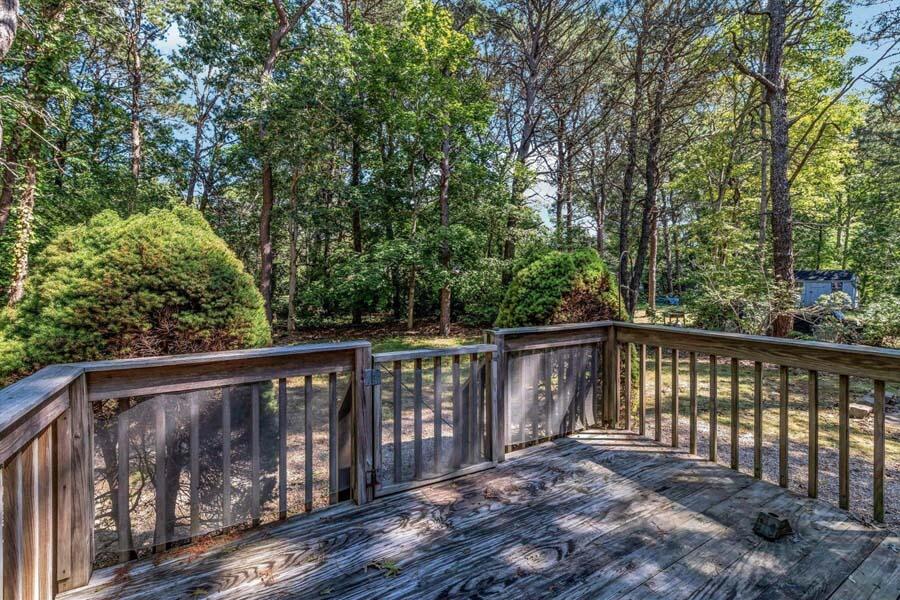 18 Pamet Road West Yarmouth, MA 02673 - Photo 19 of 23 a balcony with wooden floor and fence