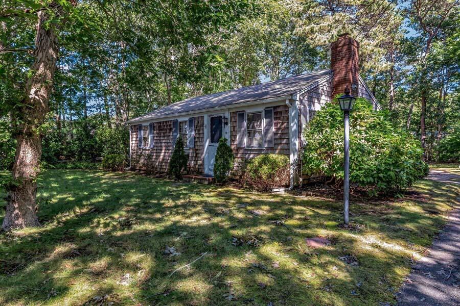 18 Pamet Road West Yarmouth, MA 02673 - Photo 3 of 23 a view of a house with backyard and sitting area