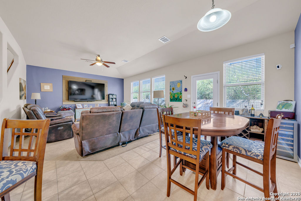 10222 Shawnee Converse, TX 78109 - Photo 13 of 28 a view of a dining room with furniture window and wooden floor
