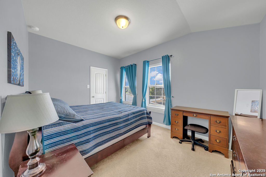10222 Shawnee Converse, TX 78109 - Photo 22 of 28 a bedroom with furniture and a window